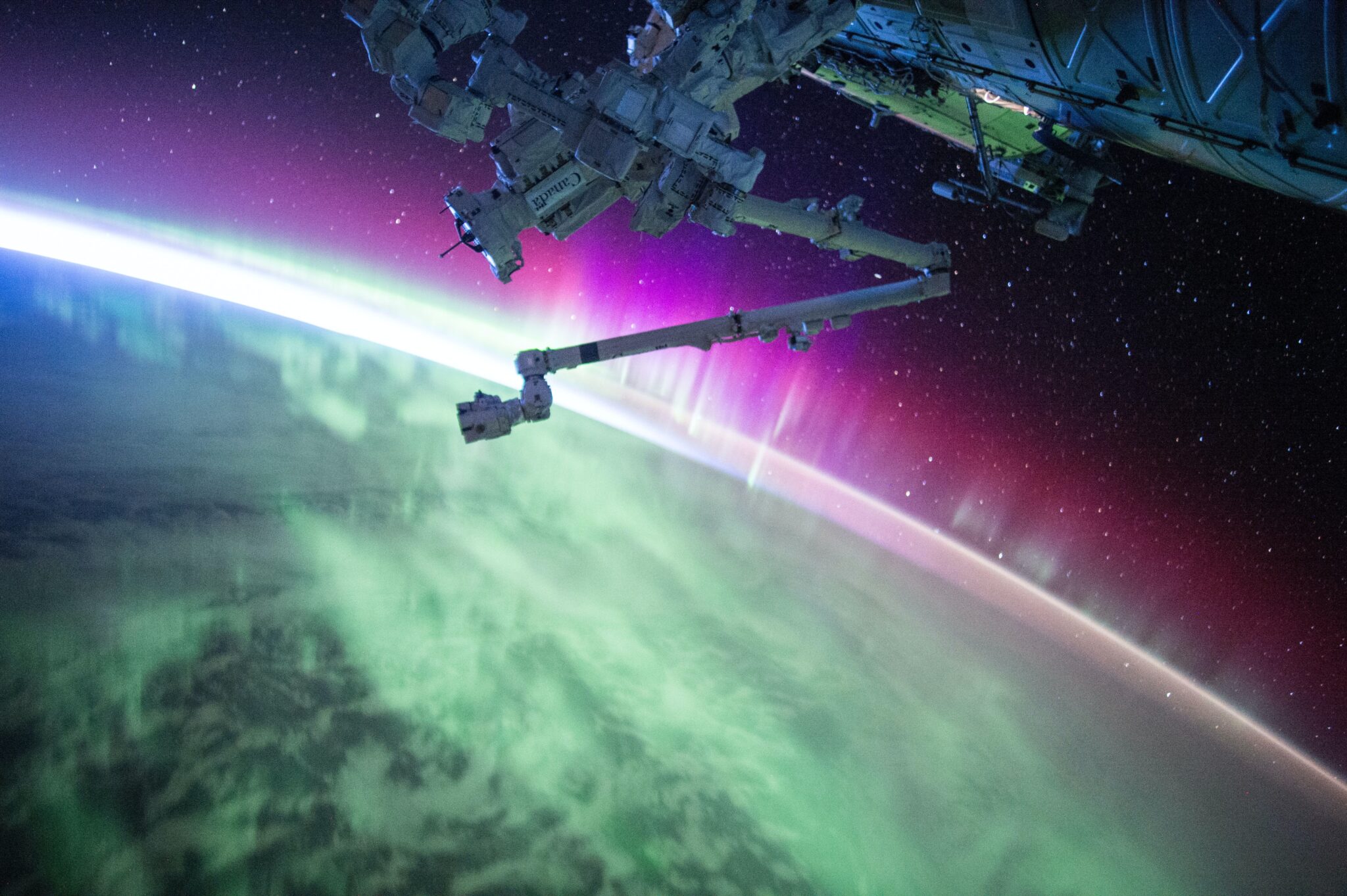Arm of a space aircraft up in space.