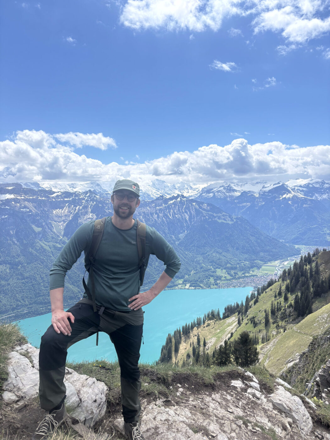 A man standing on the top of a mountain.