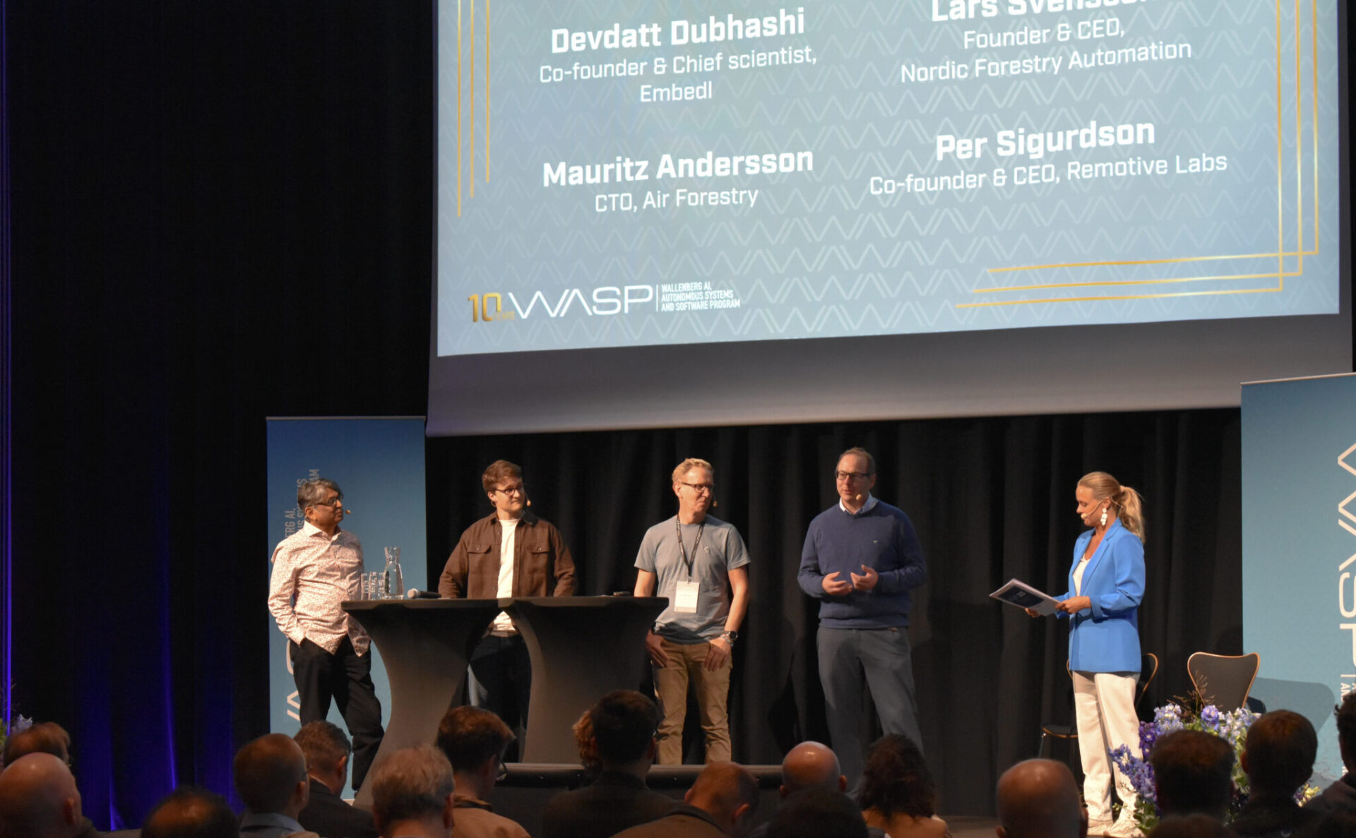 Panel discussion 'From startup to global impact - collaboration as the catalyst,' featuring Devdatt Dubhashi of Embedl, Lars Svensson of NFA Nordic Forestry Automation, Per Sigurdson of Remotive Labs, Mauritz Andersson of Air Forestry and moderator Helena Witktelius.