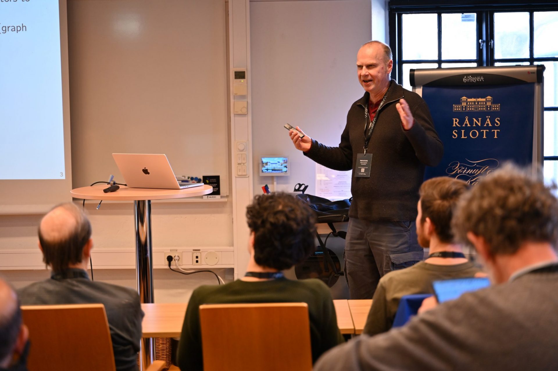 Man talking in fron of audience