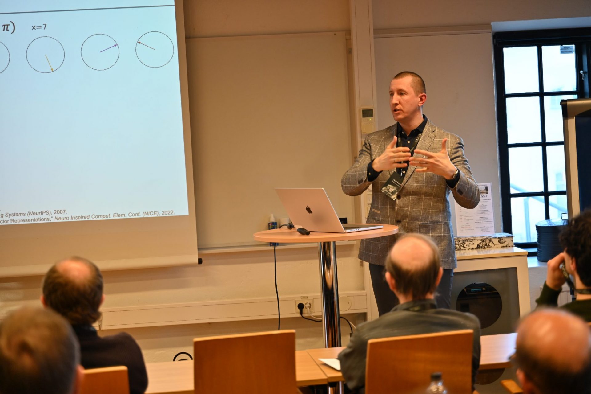 Man talking in fron of audience