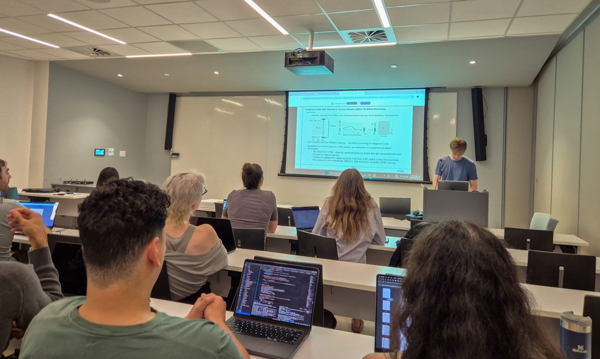 Daniel Lawson, PhD from the REAL group at Mila, presenting his work during meeting with WASP visitors.