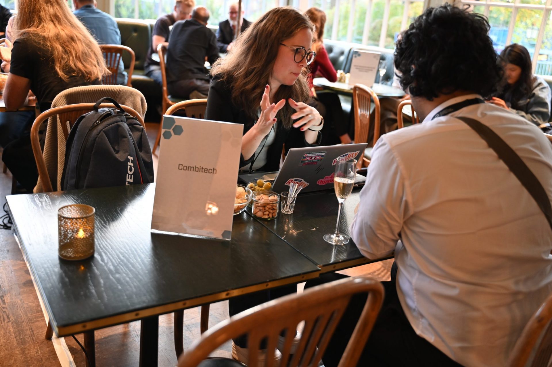 Woman and man sitting, chatting by a table