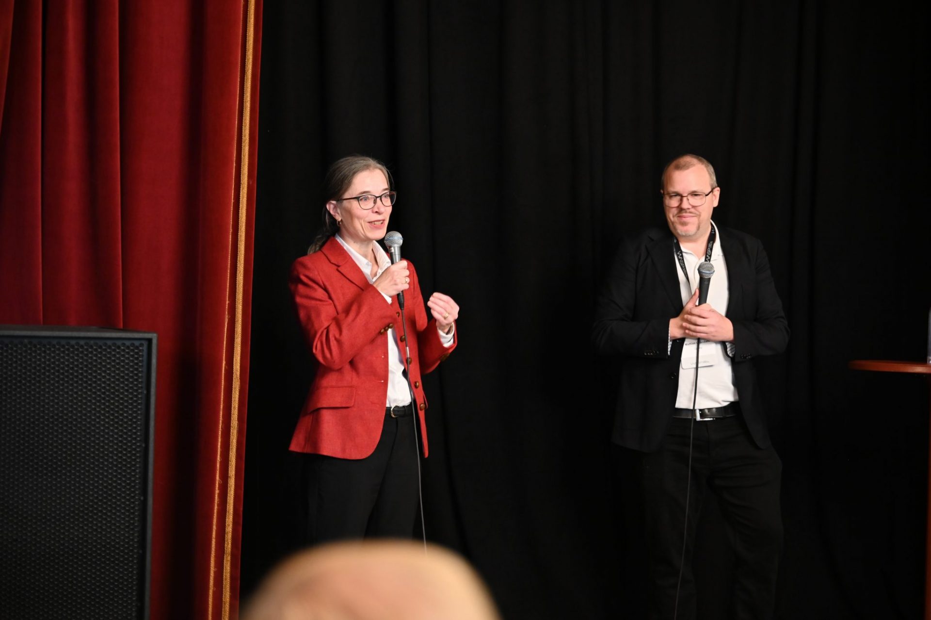 Woman and man on stage
