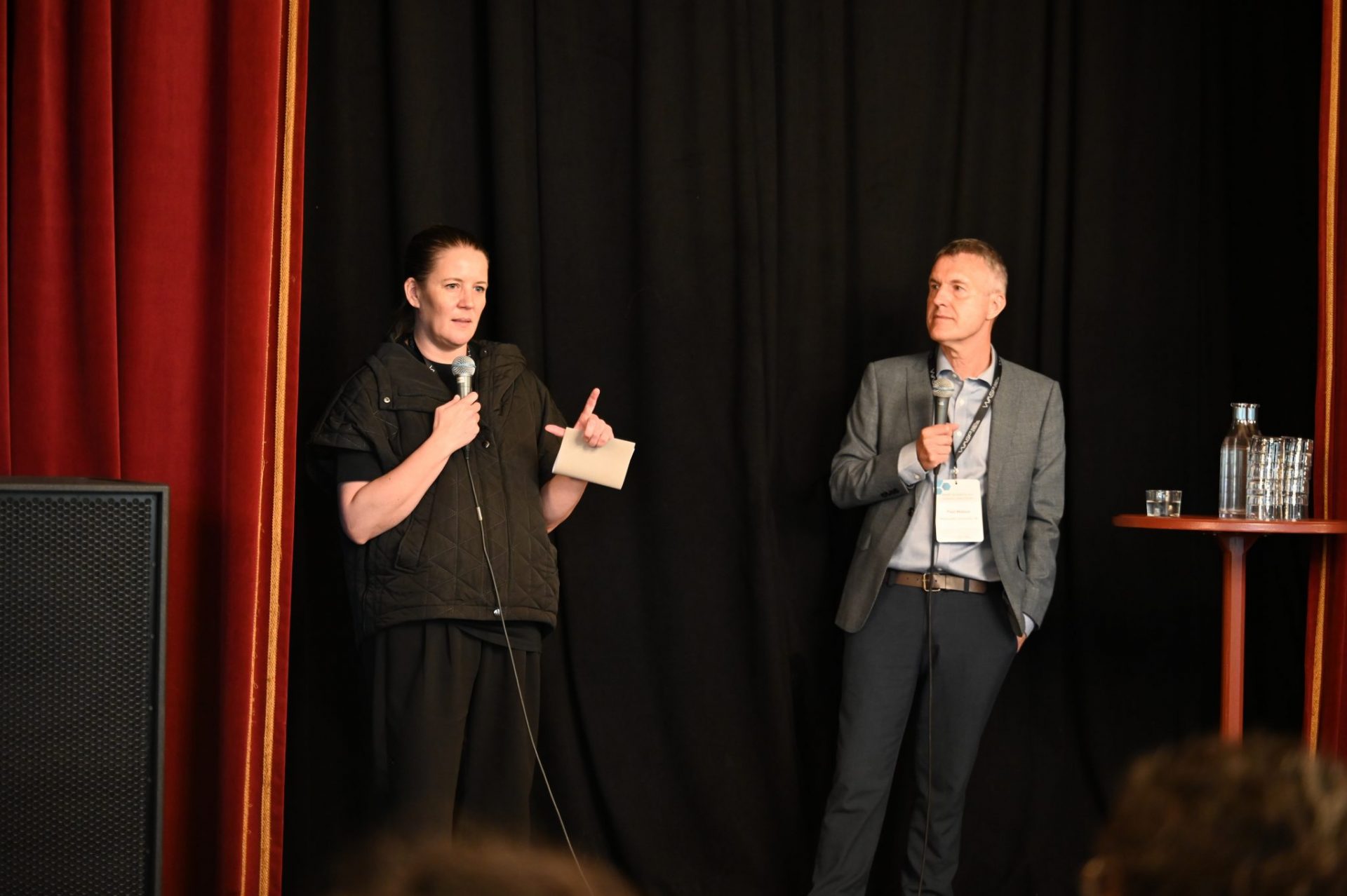 Woman and man on stage
